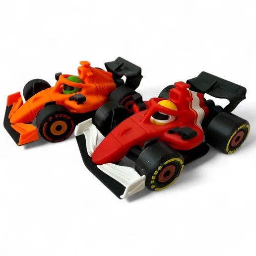 Four 3D printed Race Brain F1 racers in red, teal, orange and green